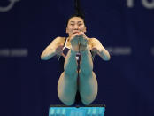 Suji Kim of Korea competes in women's diving 3m springboard preliminary at the Tokyo Aquatics Centre at the 2020 Summer Olympics, Friday, July 30, 2021, in Tokyo, Japan. (AP Photo/Dmitri Lovetsky)