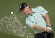Ernie Els, of South Africa, chips out of a bunker on the second hole during the second round of the Masters golf tournament Friday, April 11, 2014, in Augusta, Ga. (AP Photo/Chris Carlson)