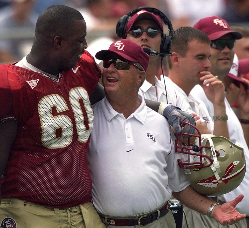 Bobby Bowden and Tarlos Thomas, left, celebrate FSU's victory over Miami in 1999.