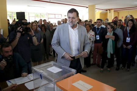 Spain's Prime Minister Mariano Rajoy arrives at a polling station during regional and municipal elections in Madrid, Spain, May 24, 2015. REUTERS/Juan Medina