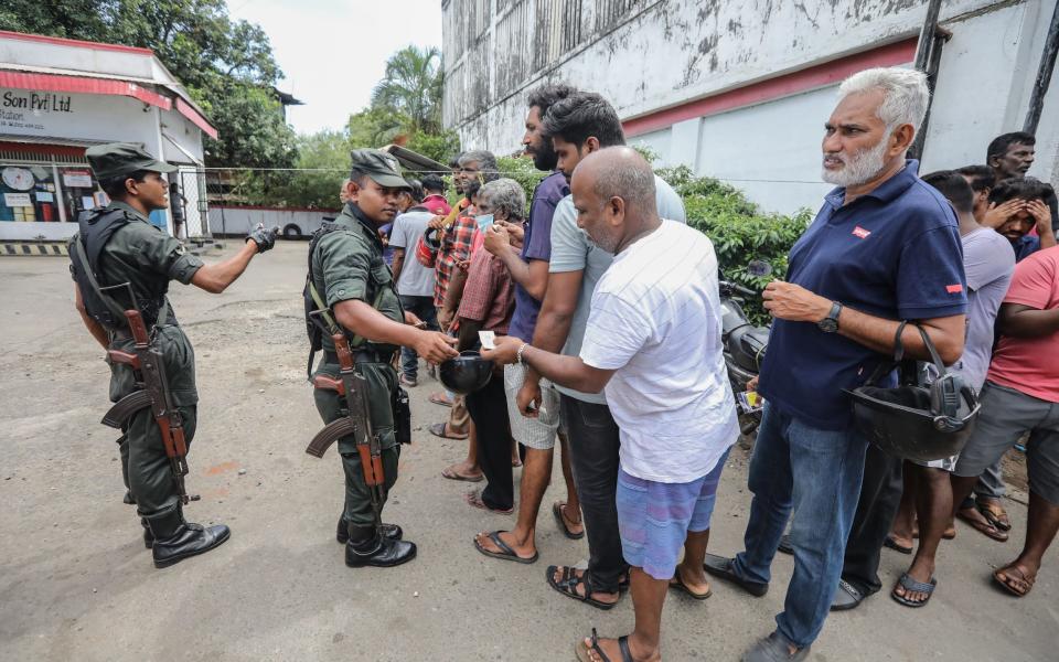 The military issue tokens to essential workers to buy petrol - CHAMILA KARUNARATHNE/EPA-EFE/Shutterstock