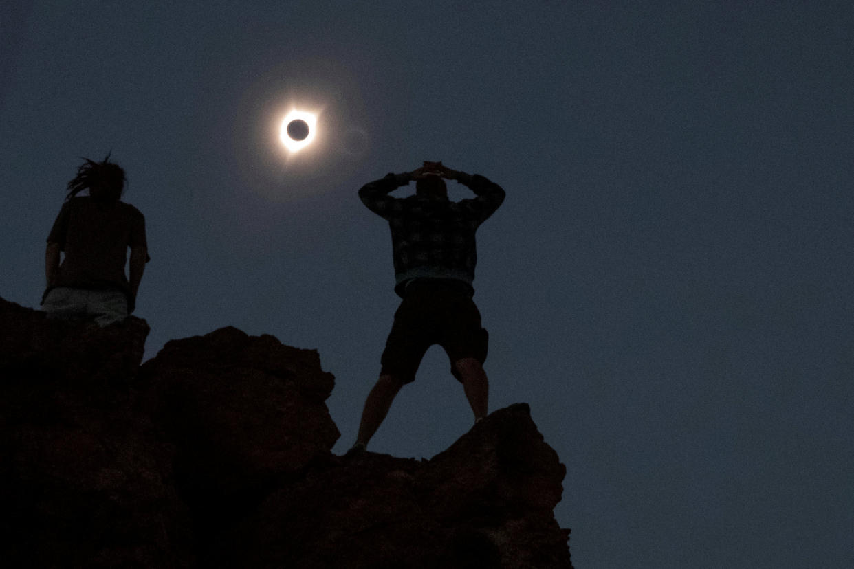 2017: People watch a total solar eclipse from atop a hiking trail in Oregon's Painted Hills.