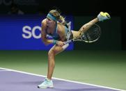 Eugenie Bouchard of Canada serves to Ana Ivanovic of Serbia during their WTA Finals singles tennis match at the Singapore Indoor Stadium October 22, 2014. REUTERS/Edgar Su