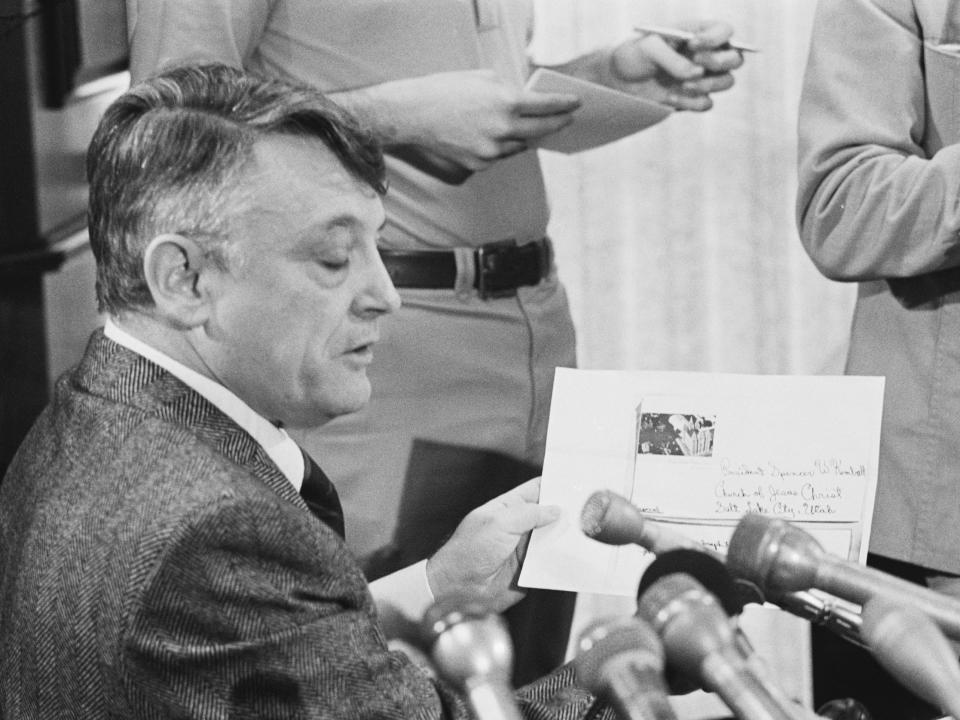 An attorney holds a copy of one of the wills purportedly made by Howard Hughes.