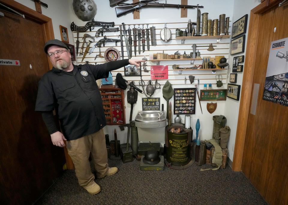 Chuck Lovelace, owner of Essential Shooting Supplies, shows his military items at his gun shop in Park Falls. Lovelace, a military veteran, served most recently as a Senior Supply NCO for Headquarters Company 416th Theater Engineer Command as an AGR (Active Guard Reserve) Soldier.