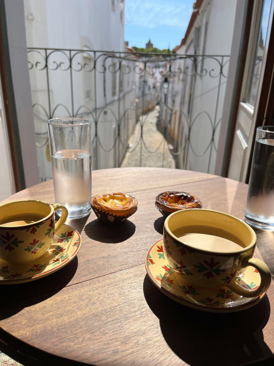 Coffee and traditional Portuguese custard tarts called “pasteis de nata" are displayed in Évora, Portugal on Sept. 20, 2023. (Kristen de Groot via AP)