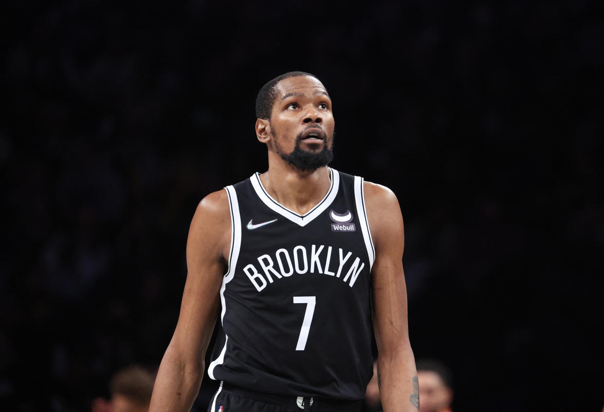 NEW YORK, NEW YORK - APRIL 23:  Kevin Durant #7 of the Brooklyn Nets looks on against the Boston Celtics during Game Three of the Eastern Conference First Round NBA Playoffs at Barclays Center on April 23, 2022 in New York City.  NOTE TO USER: User expressly acknowledges and agrees that, by downloading and or using this photograph, User is consenting to the terms and conditions of the Getty Images License Agreement.  (Photo by Al Bello/Getty Images).