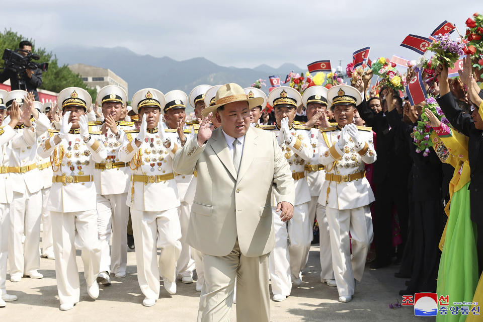 In this photo provided by the North Korean government, North Korea leader Kim Jong Un, center, acknowledges participants during a launching ceremony of what is says a new nuclear attack submarine "Hero Kim Kun Ok" at an unspecified place in North Korea Wednesday, Sept. 6, 2023. Independent journalists were not given access to cover the event depicted in this image distributed by the North Korean government. The content of this image is as provided and cannot be independently verified. Korean language watermark on image as provided by source reads: "KCNA" which is the abbreviation for Korean Central News Agency. (Korean Central News Agency/Korea News Service via AP)