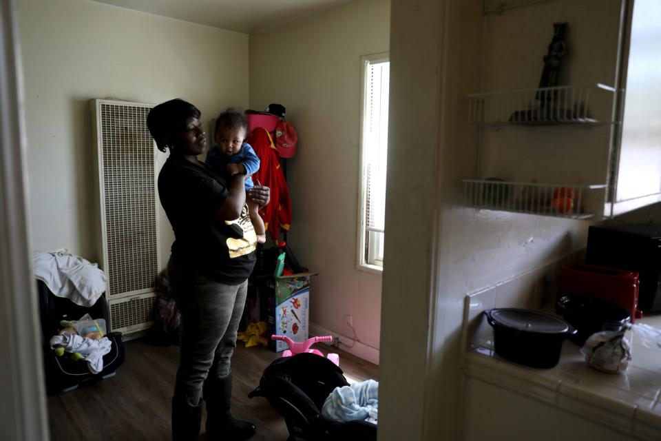 Tamela Richardson with visiting grandson Loyal at the Chesapeake Apartments.