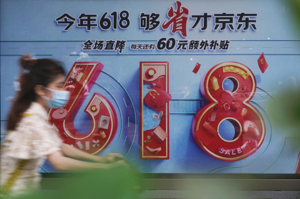 HANGZHOU, CHINA - MAY 30, 2023 - A citizen rides past a poster of JD.com's 2023 "618" online promotion in Hangzhou, east China's Zhejiang province, May 30, 2023. (Photo credit should read Long Wei / CFOTO/Future Publishing via Getty Images)