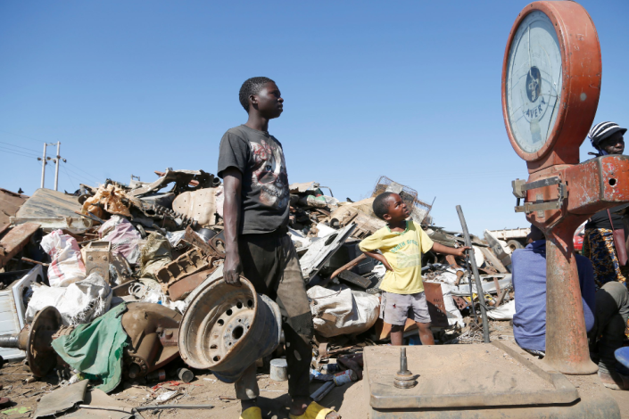 People at a scrap metal outlet in Harare, Zimbabwe - Friday 8 July 2022