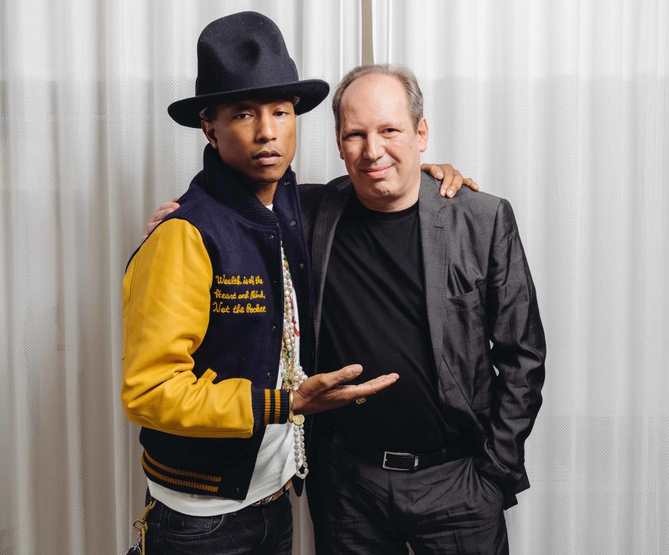 In this Tuesday, March 25, 2014 photo, Pharrell, left, and Hans Zimmer pose at The Standard Hotel during press day for their collaboration on the soundtrack for "The Amazing Spider-Man 2," in Los Angeles. The film releases May 2, 2014. (Photo by Casey Curry/Invision/AP)