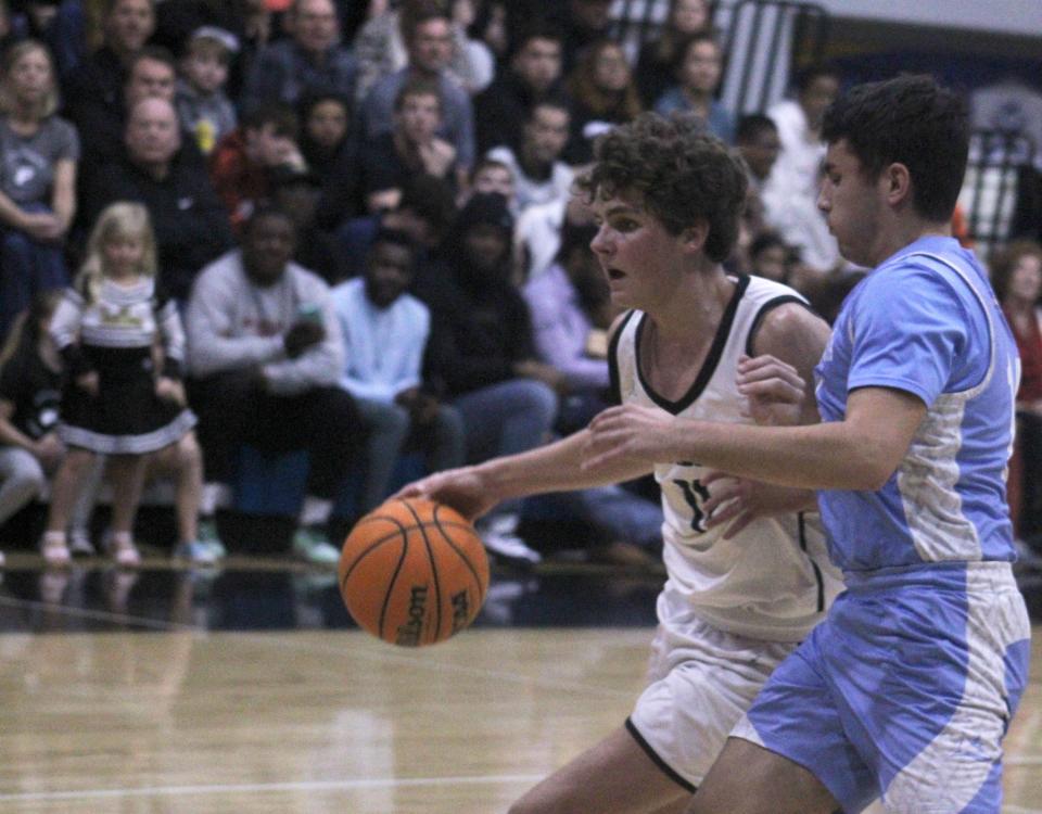 Providence guard David Fonville (11) dribbles as Ponte Vedra guard Cole Simmons (14) defends during  a high school boys basketball game on January 6, 2023. [Clayton Freeman/Florida Times-Union]