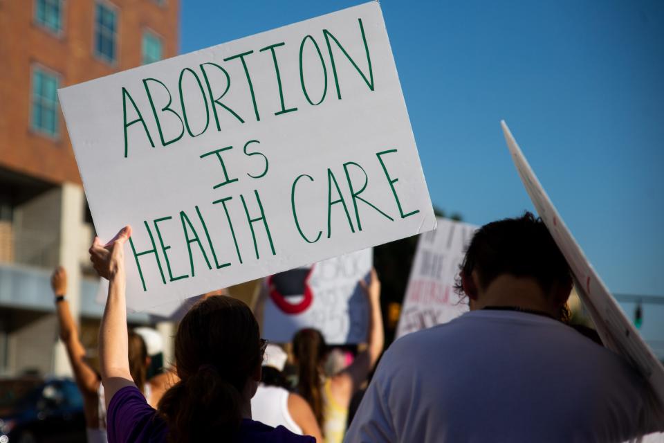 Hundreds of abortion activists take to the streets to protest the Supreme Court's majority decision that leaves the legality of abortion to the states Friday, June 24, 2022, in downtown Grand Rapids. 