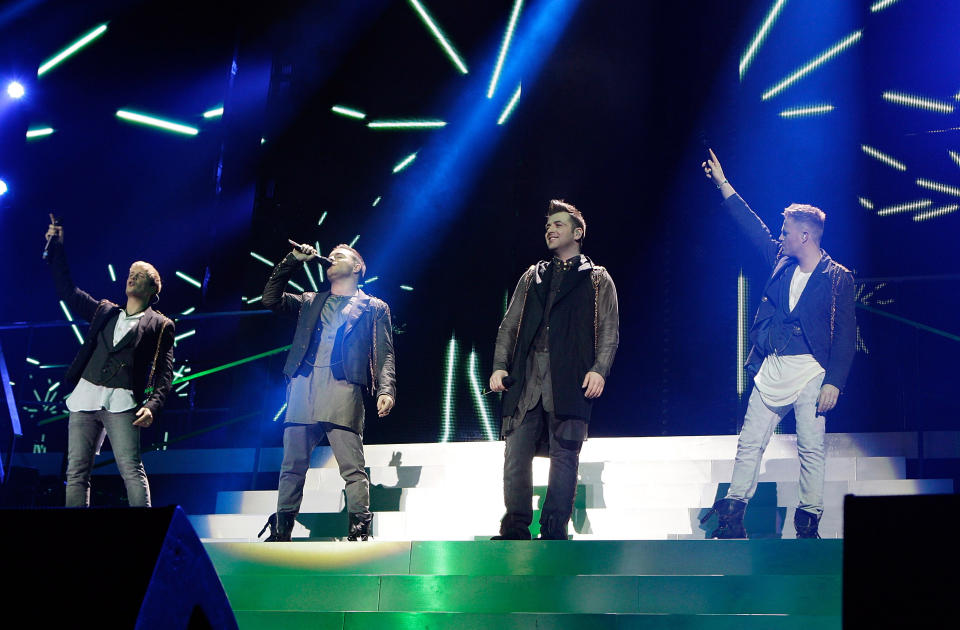(L-R) Kian Egan, Shane Filan, Mark Feehily and Nicky Byrne of Westlife performing live in concert during the band's farewell tour at O2 Arena in London.