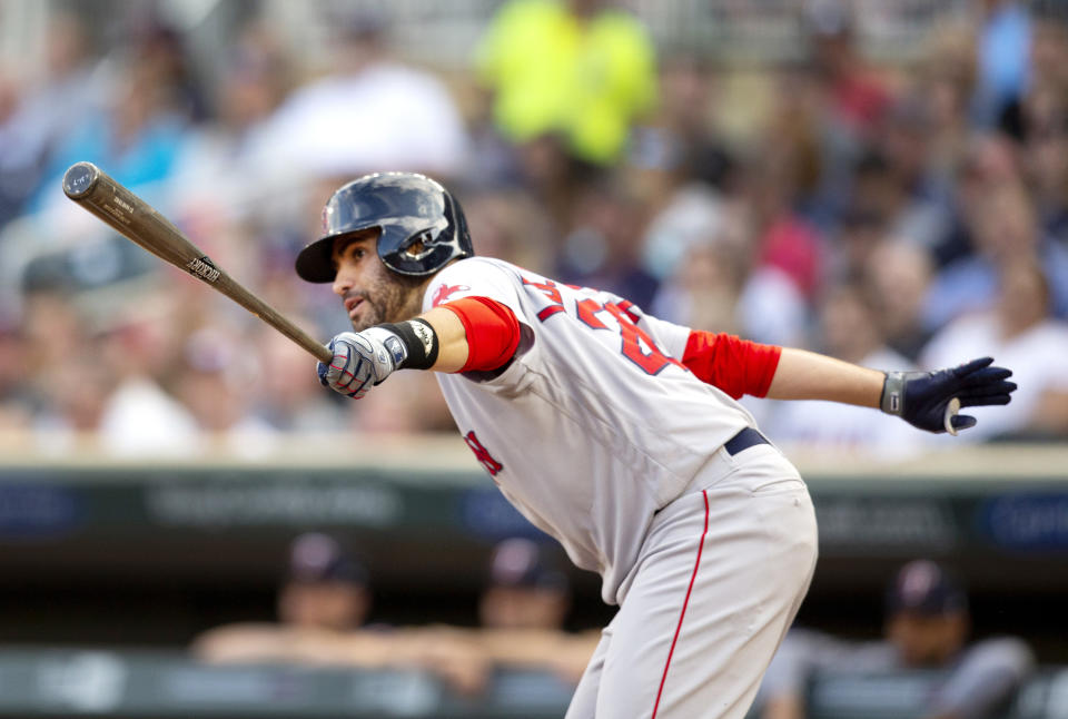 Boson Red Sox's J.D. Martinez watches his RBI-single against the Minnesota Twins in the first inning of a baseball game Monday, June 17, 2019, in Minneapolis. (AP Photo/Andy Clayton- King)