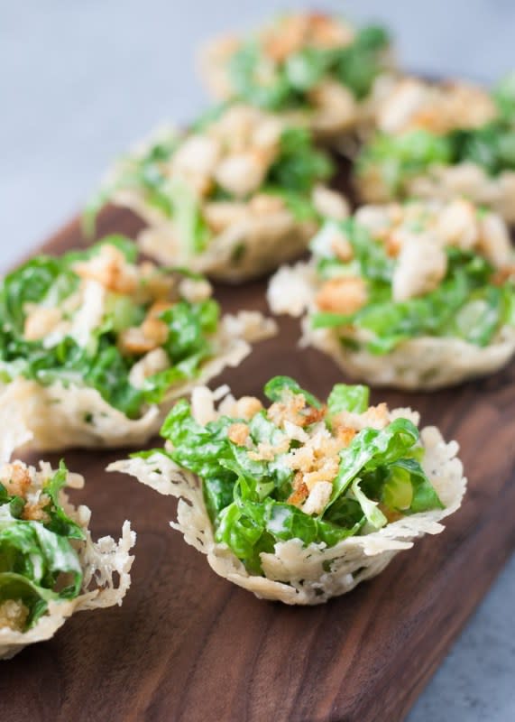 <p>Life Is But A Dish</p><p>Impress your guests with this lighter appetizer. They are easy to make and fun to eat. And yes, that's an edible cheese cup! </p><p><strong>Get the recipe: <a href="https://www.lifeisbutadish.com/mini-caesar-salad-cups/" rel="nofollow noopener" target="_blank" data-ylk="slk:Mini Chopped Caesar Salad Cups;elm:context_link;itc:0;sec:content-canvas" class="link ">Mini Chopped Caesar Salad Cups</a></strong></p><p><strong>Related: <a href="https://parade.com/970890/kristamarshall/easy-main-dish-salad-recipes/" rel="nofollow noopener" target="_blank" data-ylk="slk:50 Main Dish Salads;elm:context_link;itc:0;sec:content-canvas" class="link ">50 Main Dish Salads</a></strong></p>