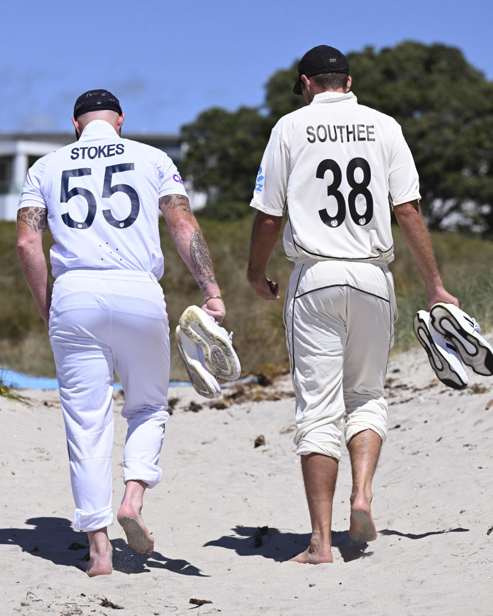 Cricket captains Tim Southee of New Zealand, left, and Ben Stokes of England leave Mt Maunganui Beach, Tauranga, New Zealand after posing for a photo on Wednesday, Feb. 15, 2023, for the upcoming 2-test series. The first test is scheduled to start Thursday. (Andrew Cornaga/Photosport via AP)