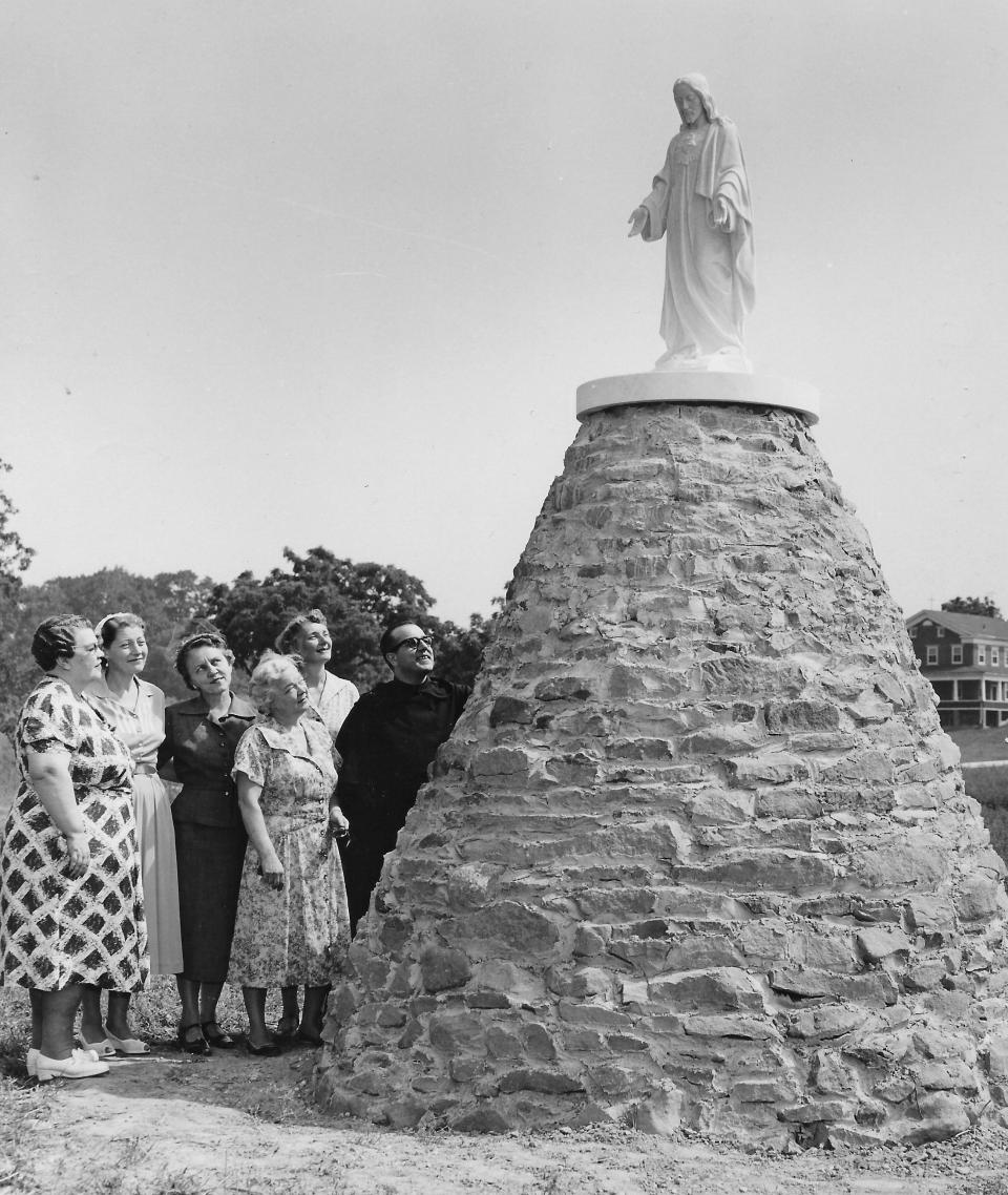 Infant of Prague Circle members Mae White, Dolores Hildreth, Olga Turney, Marcella Bell and Constance Weigand inspect a new shrine in 1955 with the Rev. Mario Dittami, prior of the monastery in Coventry Township.