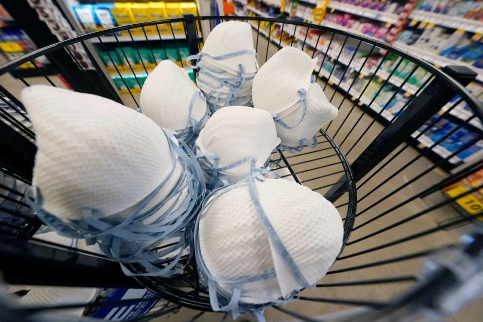 A product stall filled with free N95 respirator masks, provided by the U.S. Department of Health and Human Services, sits outside the pharmacy at this Jackson, Miss., Kroger grocery store, Wednesday, Feb. 2, 2022. The Biden administration is making 400 million N95 masks available for free to U.S. residents. Authorities note the masks’ offer better protection against the omicron variant of COVID-19 than cloth masks. (AP Photo/Rogelio V. Solis)