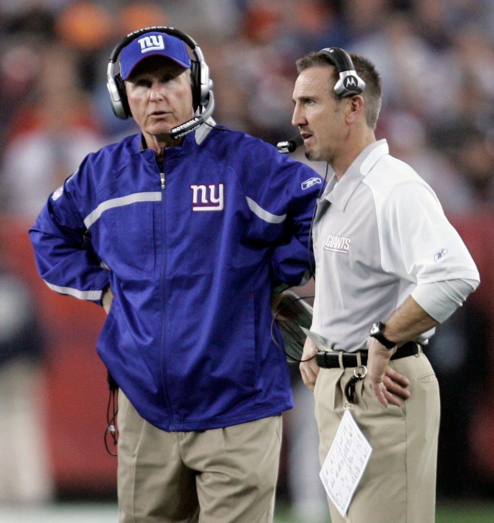 New York Giants head coach Tom Coughlin, left, and defensive coordinator Steve Spagnuolo talk on the sideline during the second quarter of the Super Bowl XLII football game against the New England Patriots at University of Phoenix Stadium on Sunday, Feb. 3, 2008 in Glendale, Ariz. (AP Photo/Eric Gay)