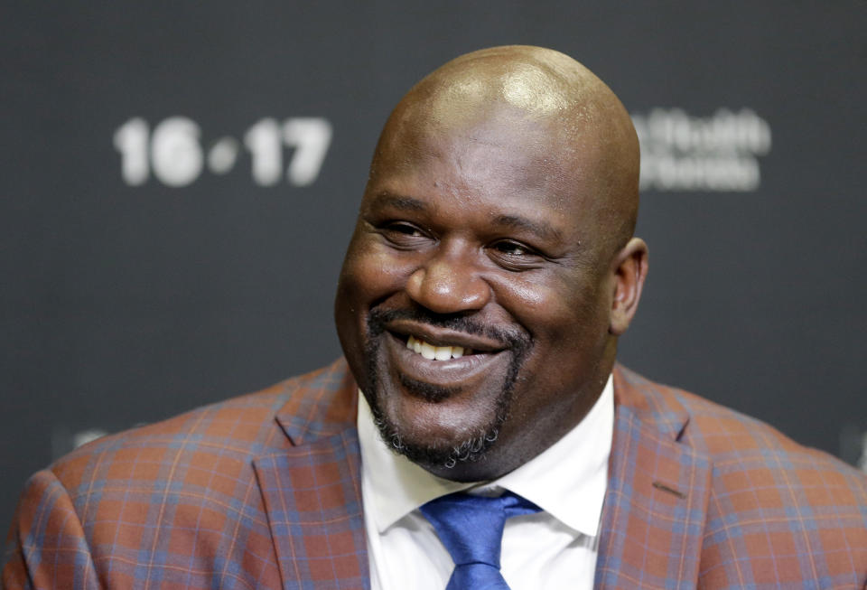 Retired Hall of Fame basketball player Shaquille O'Neal smiles as he talks to reporters during an NBA basketball news conference, Thursday, Dec. 22, 2016, in Miami. The Heat raise O'Neal's No. 32 banner to the rafters. He will be the third Heat player to get such an honor, joining only Alonzo Mourning and Tim Hardaway. (AP Photo/Alan Diaz)