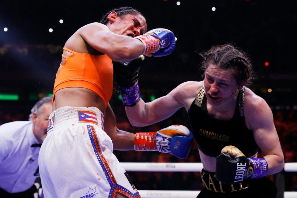 Katie Taylor punches Amanda Serrano.