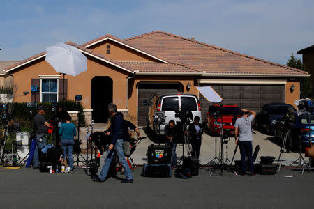 FILE PHOTO: News media gather outside the home of David Allen and Louise Anna Turpin in Perris, California, U.S., January 16, 2018. REUTERS/Mike Blake/File Photo