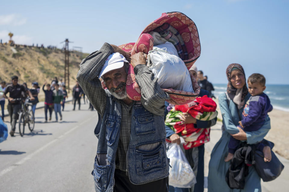 Displaced Palestinians trying to walk back from central Gaza Strip to northern Gaza Strip , Sunday, April 14, 2024. (AP Photo/Abdel Kareem Hana)