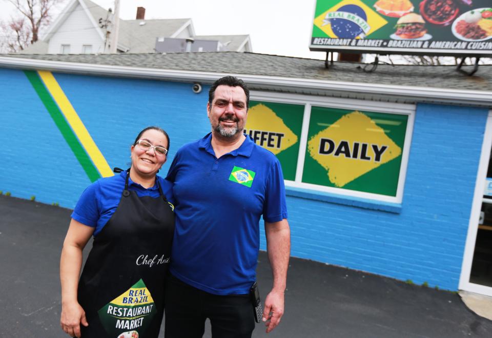 Owners Andreia Mourao and Alan Martins stand outside Real Brazil Restaurant and Market on Tremont Street in Taunton on Thursday, April 14, 2022.