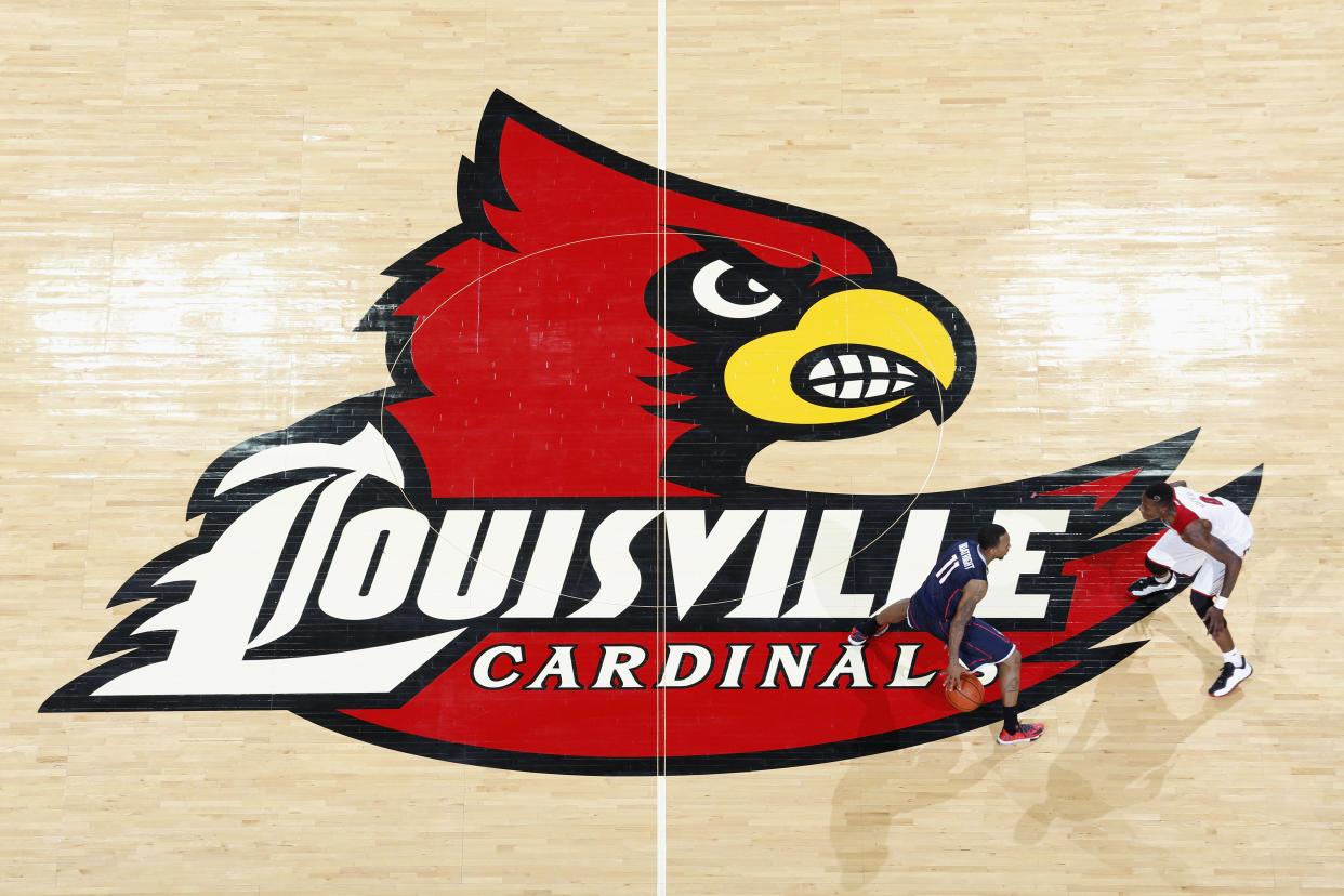 LOUISVILLE, KY - MARCH 8: General view of the Louisville Cardinals logo at midcourt as action takes place during the game against the Connecticut Huskies at KFC Yum! Center on March 8, 2014 in Louisville, Kentucky. Louisville won 81-48 to clinch a share of the American Athletic Conference championship. (Photo by Joe Robbins/Getty Images) 