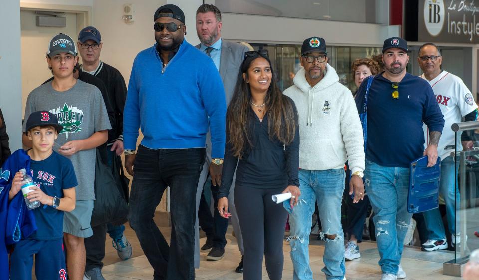 Baseball Hall of Famer and retired Red Sox star David Ortiz and eternalHealth CEO Pooja Ika lead an "intentional walk" Monday morning around the Natick Mall for eternalHealth's Medicare Advantage plan, Oct. 10, 2022.