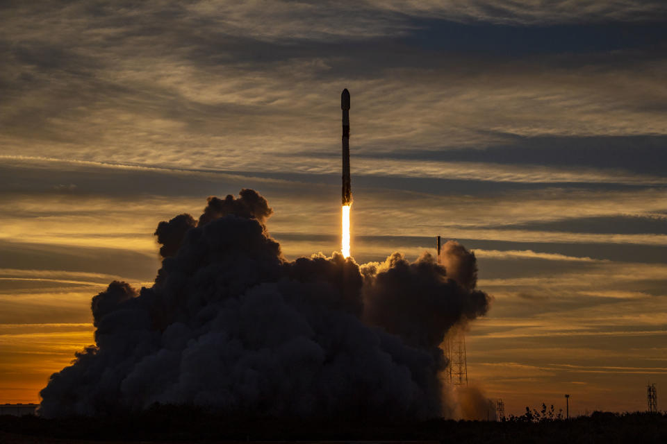 A SpaceX Falcon 9 rocket launches 21 Starlink 