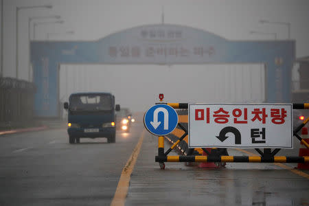 A traffic sign is seen on the Grand Unification Bridge which leads to the truce village Panmunjom, just south of the demilitarized zone separating the two Koreas, in Paju, South Korea, May 16, 2018. REUTERS/Kim Hong-Ji