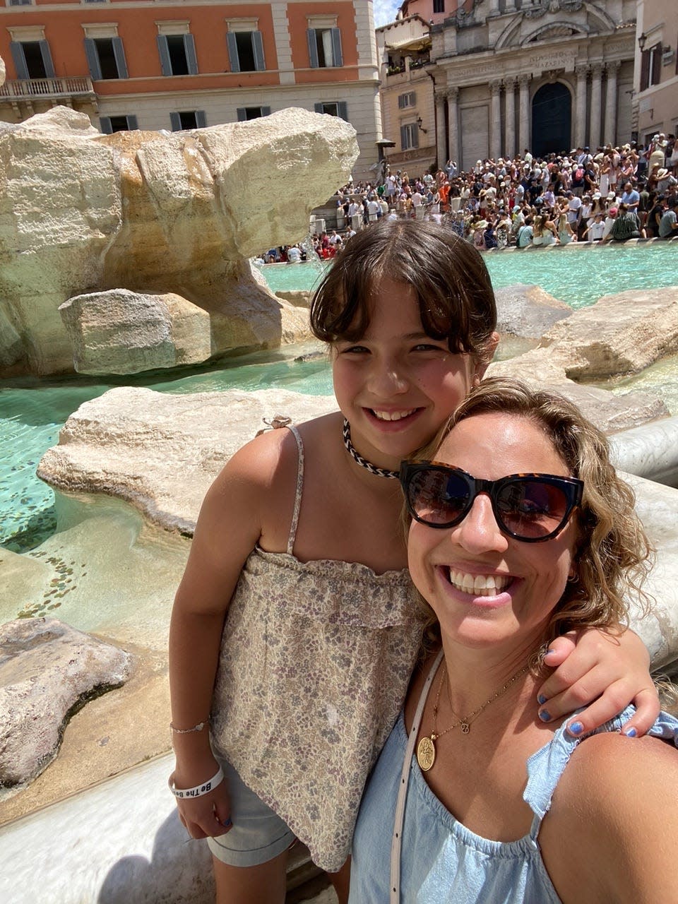 The author and her daughter in front of the Trevi Fountain.