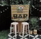<p> Your outdoor bar ideas needn't be expensive if you're on the lookout for a cheap garden. If you're feeling creative and have a few DIY skills up your sleeve, then consider building one out of reclaimed materials as a budget-friendly option. </p> <p> Check out your local wood reclamation yard for pallets, old cable reels, and other bits and bobs that could be put to good use. </p> <p> Cute letters and tiny tea lights turn this bar made from an old cable reel into something very cool and rustic. We love the pink bar chairs too, for a pretty pop of color. </p>