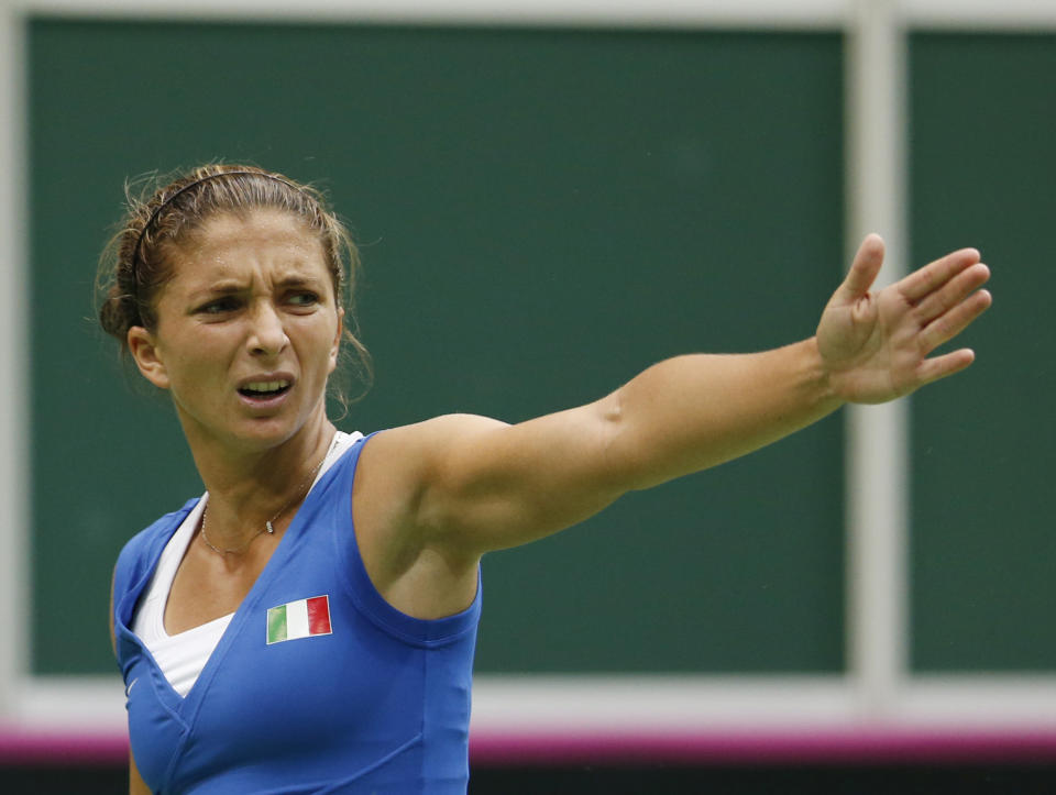 Italy's Sara Errani reacts during the tennis Fed Cup semifinals against Czech Republic's Lucie Safarova in Ostrava, Czech Republic, Saturday, April 19, 2014. (AP Photo/Petr David Josek)