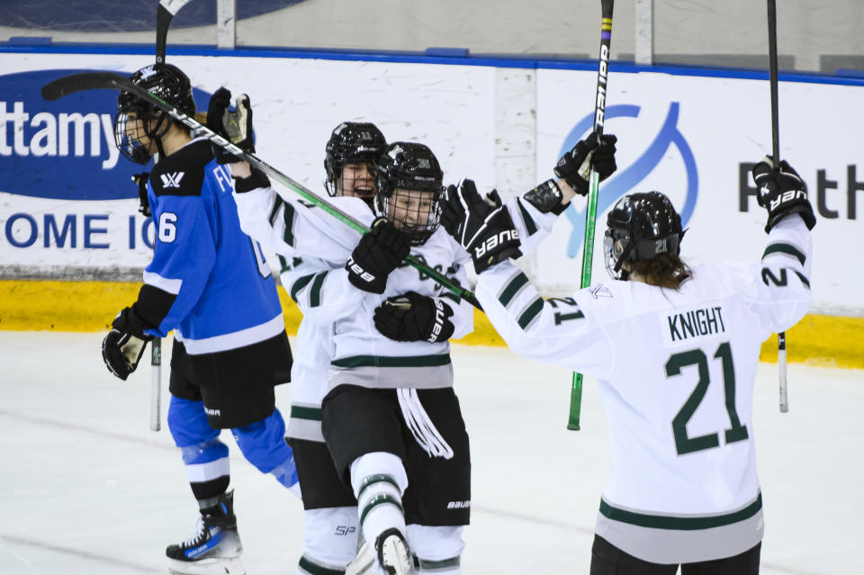 Boston's Loren Gabel (36) celebrates her goal against Toronto with forward Alina Muller (11) and Hilary Knight (21) during the third period of a PWHL hockey game, Wednesday, Jan. 17, 2024 in Toronto. (Christopher Katsarov/The Canadian Press via AP)