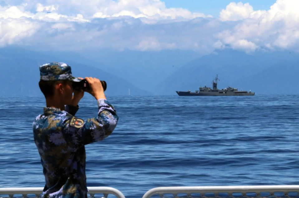 A PLA soldier looks through binoculars during combat exercises and training of the Eastern Theater Command of the Chinese People’s Liberation Army in the waters around Taiwan, August 5, 2022. <em>Photo by Lin Jian/Xinhua via Getty Images</em>