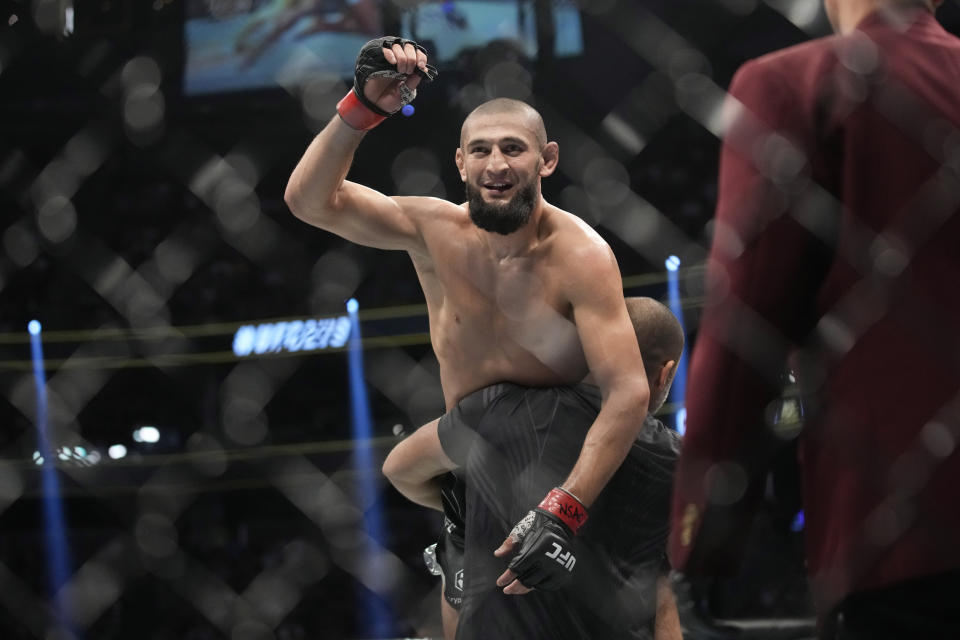 Khamzat Chimaev celebrates after defeating Kevin Holland in a 180-pound catchweight bout during the UFC 279 mixed martial arts event Saturday, Sept. 10, 2022, in Las Vegas. (AP Photo/John Locher)