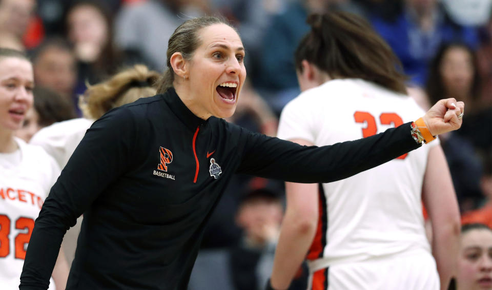 Princeton head coach Carla Berube reacts after a call during the first half of the Ivy League championship NCAA college basketball game against Harvard, Saturday, March 11, 2023, in Princeton, N.J. (AP Photo/Noah K. Murray)