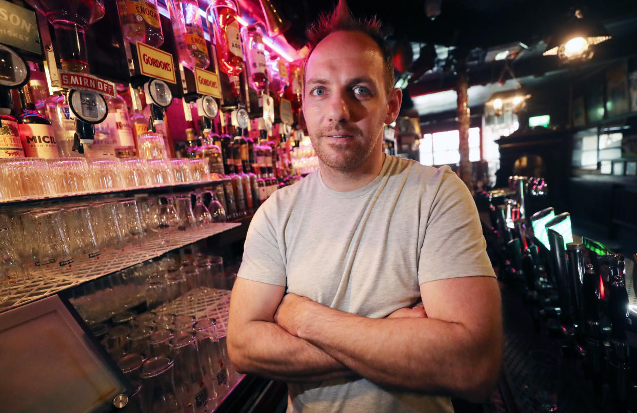 Kevin Barden behind the bar at O’Donoghue’s pub in Dublin (Niall Carson/PA)