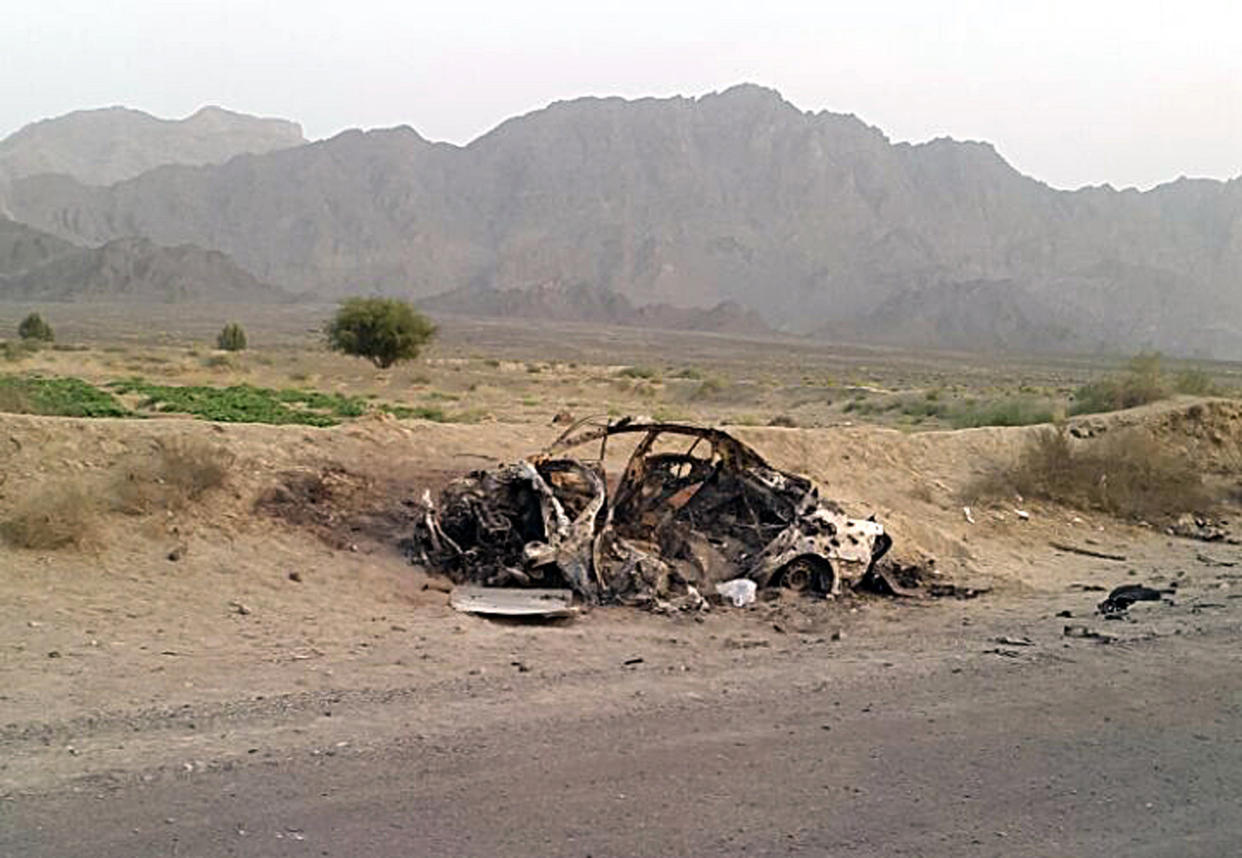 The destroyed vehicle in which Taliban leader Mohammad Akhtar Mansour was traveling in the Baluchistan province of Pakistan, near the Afghanistan border