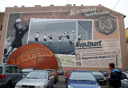 FILE PHOTO: A mural commemorates the Hungarian national football team, the Magic Magyars, of the 1950s, a memento of the country's enthusiasm for sports as it bids for the 2024 Olympic Games, in central Budapest, Hungary December 13, 2013. REUTERS/Laszlo Balogh/File Photo