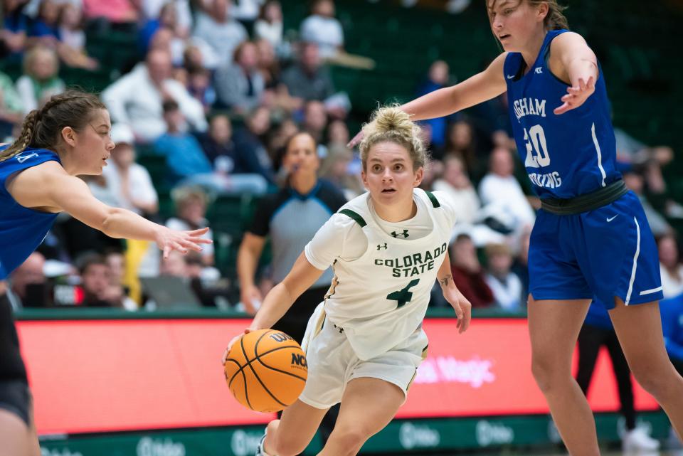 Colorado State women's basketball senior point guard McKenna Hofschild makes a drive to the basket during a game against BYU at Moby Arena on Nov. 8, 2022, in Fort Collins.