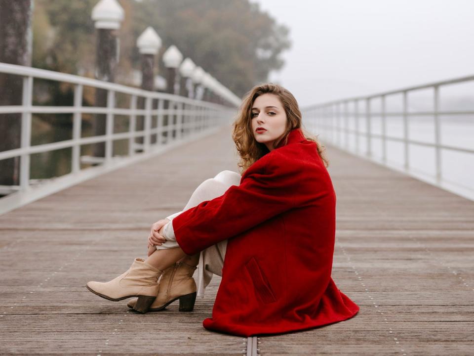 A woman in red on a dock