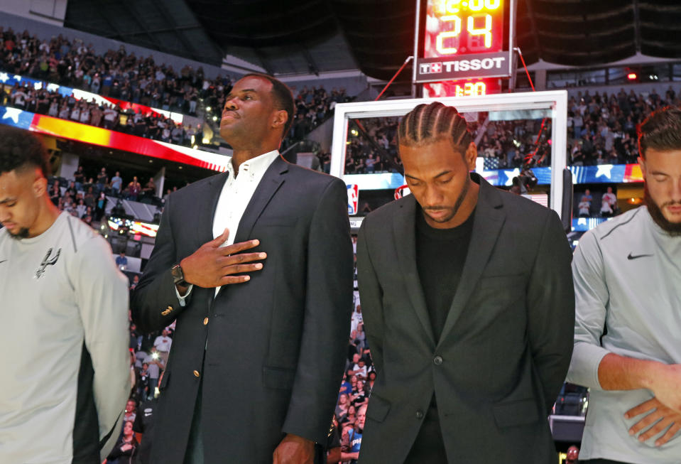 Kawhi Leonard might not be trading in his suit for a uniform any time soon. (Getty)