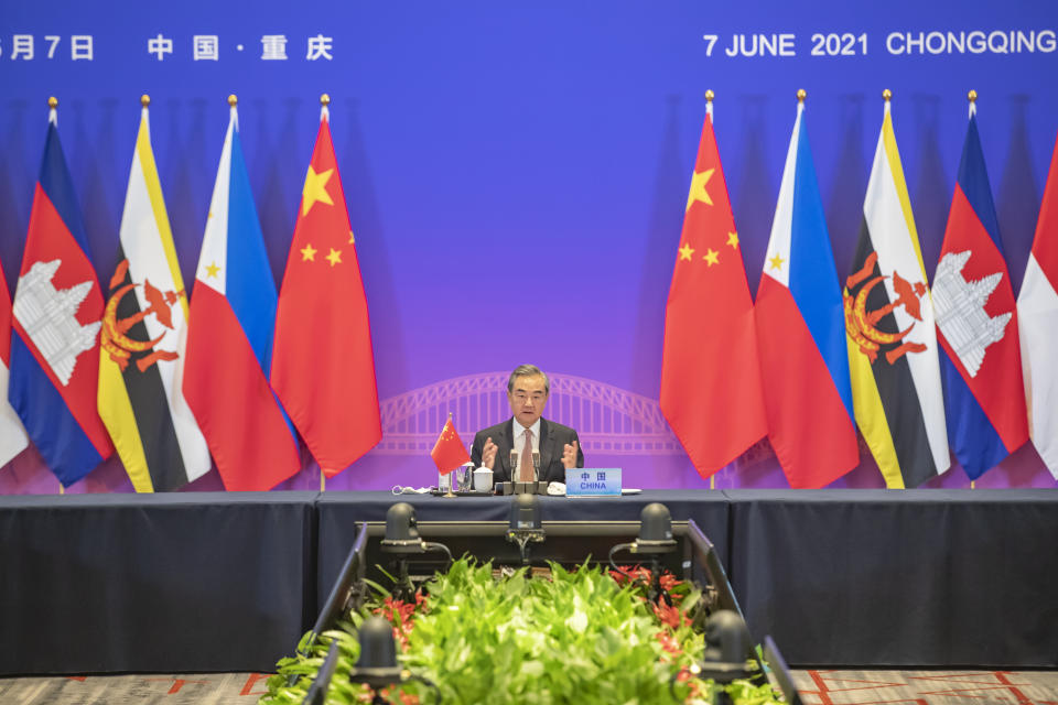 In this photo released by Xinhua News Agency, Chinese State Councilor and Foreign Minister Wang Yi speaks during a special ASEAN-China Foreign Ministers' Meeting in Celebration of the 30th Anniversary of Dialogue Relations attended by foreign ministers from ASEAN countries, in Chongqing, southwestern China, Monday, June 7, 2021. China is hosting foreign ministers from 10 Southeast Asian nations this week in the southwestern megacity of Chongqing amid heightened competition between Beijing and Washington for influence in the region. (Wang Quanchao/Xinhua via AP)