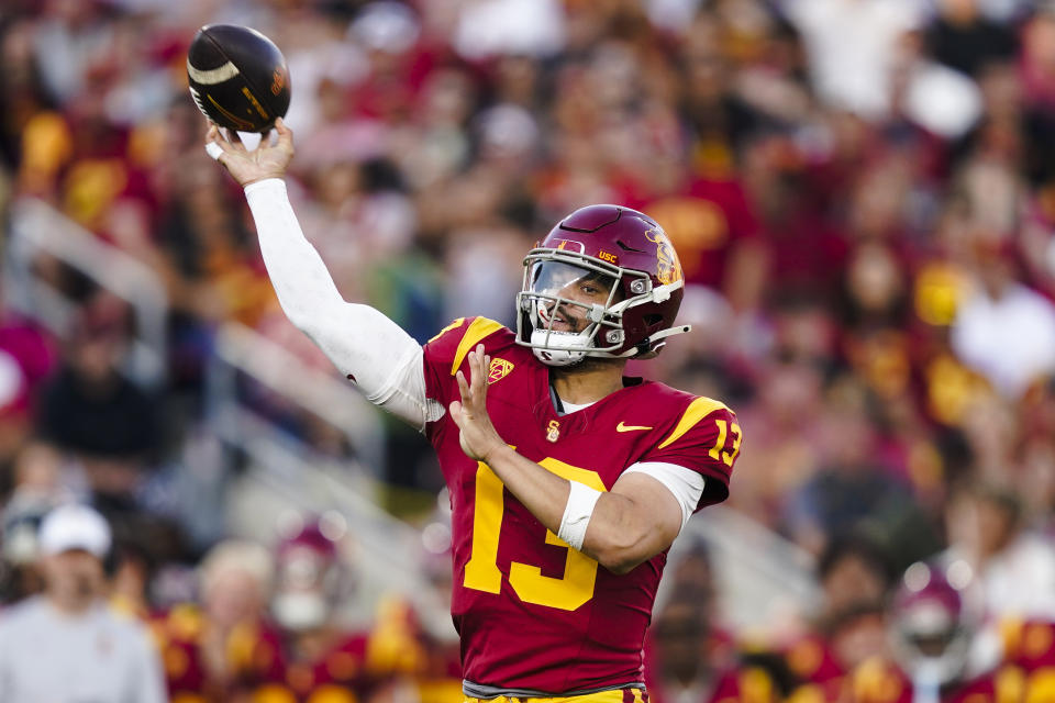 Southern California quarterback Caleb Williams throws a pass during the first half of the team's NCAA college football game against Washington, Saturday, Nov. 4, 2023, in Los Angeles. (AP Photo/Ryan Sun)