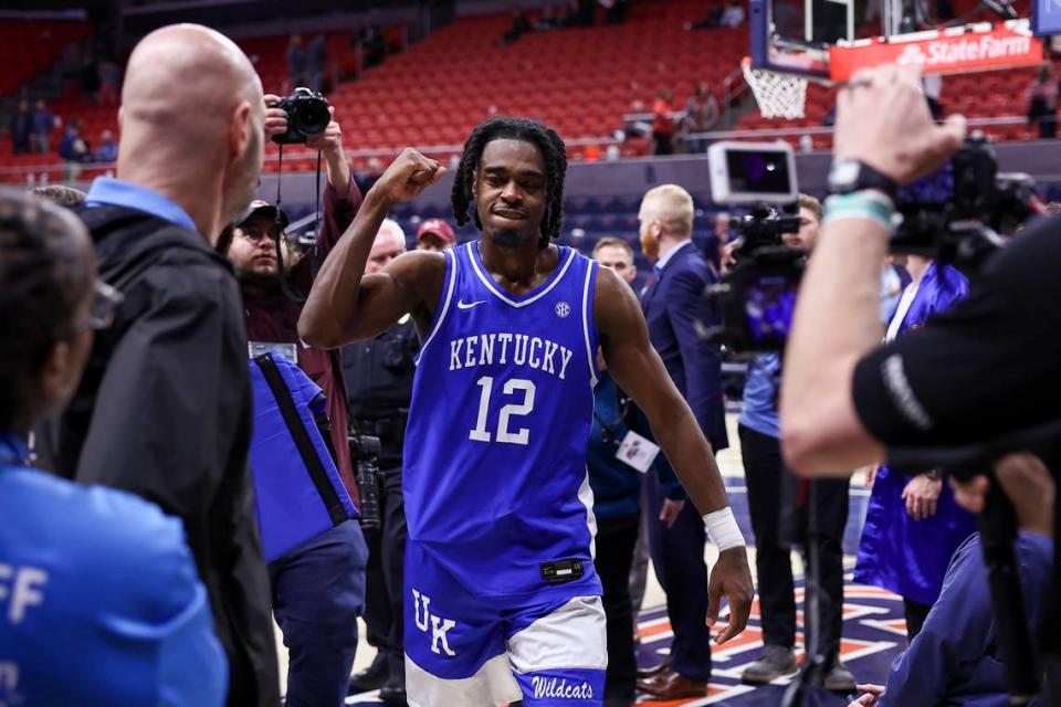 Kentucky guard Antonio Reeves (12) leaves the court after the Wildcats’ 70-59 defeat of Auburn on Saturday.